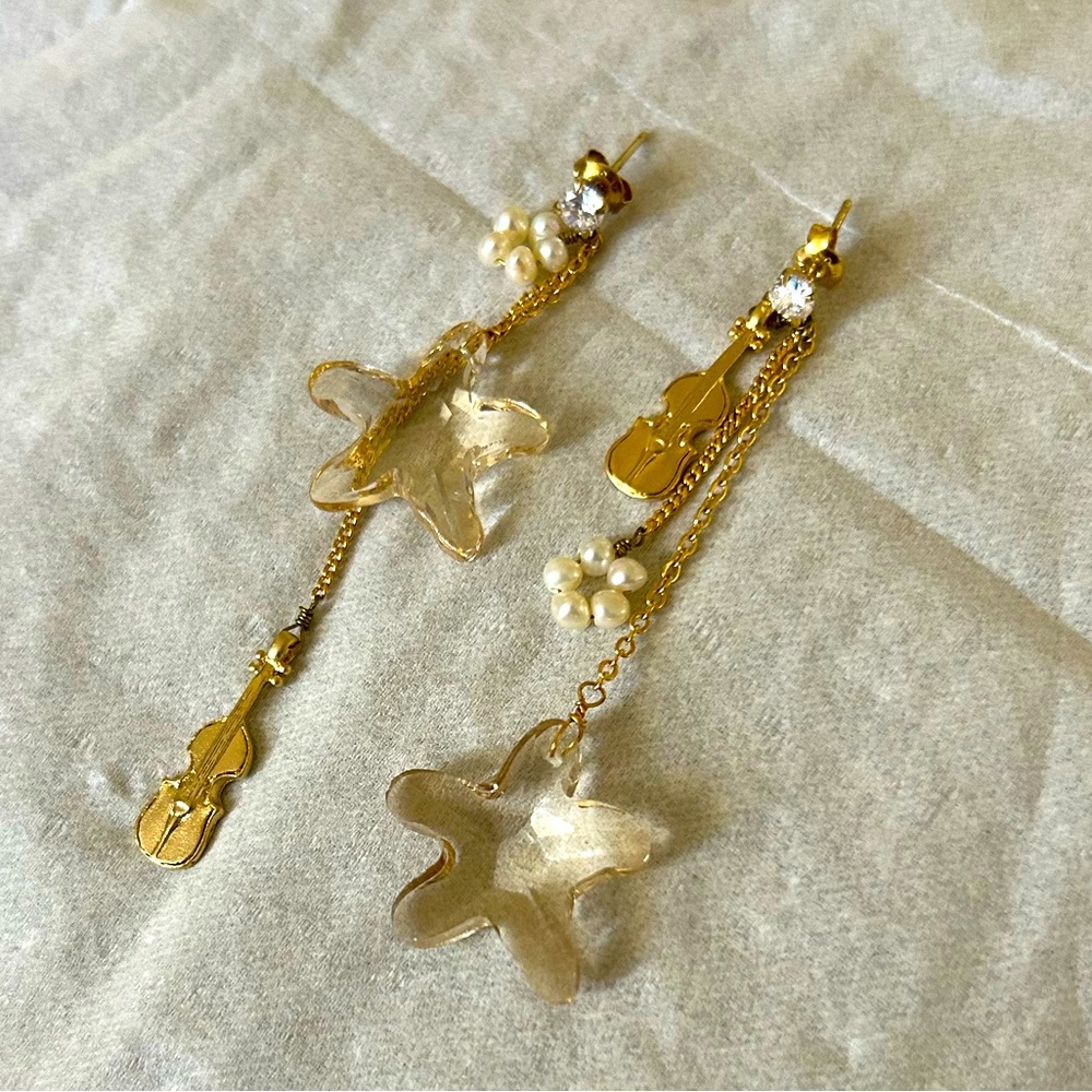 NWOT Long dangling gold earrings guitar crystal star